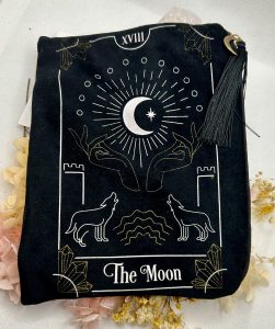 Black velvet purse with The Moon tarot card design and tassel zip